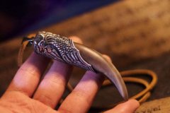 摸金校尉的摸金符为什么像牙齿,是什么动物的牙吗?